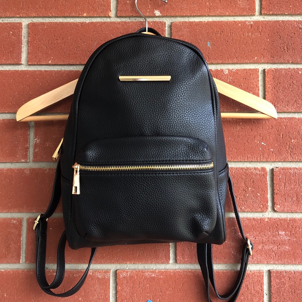 black faux leather back pack